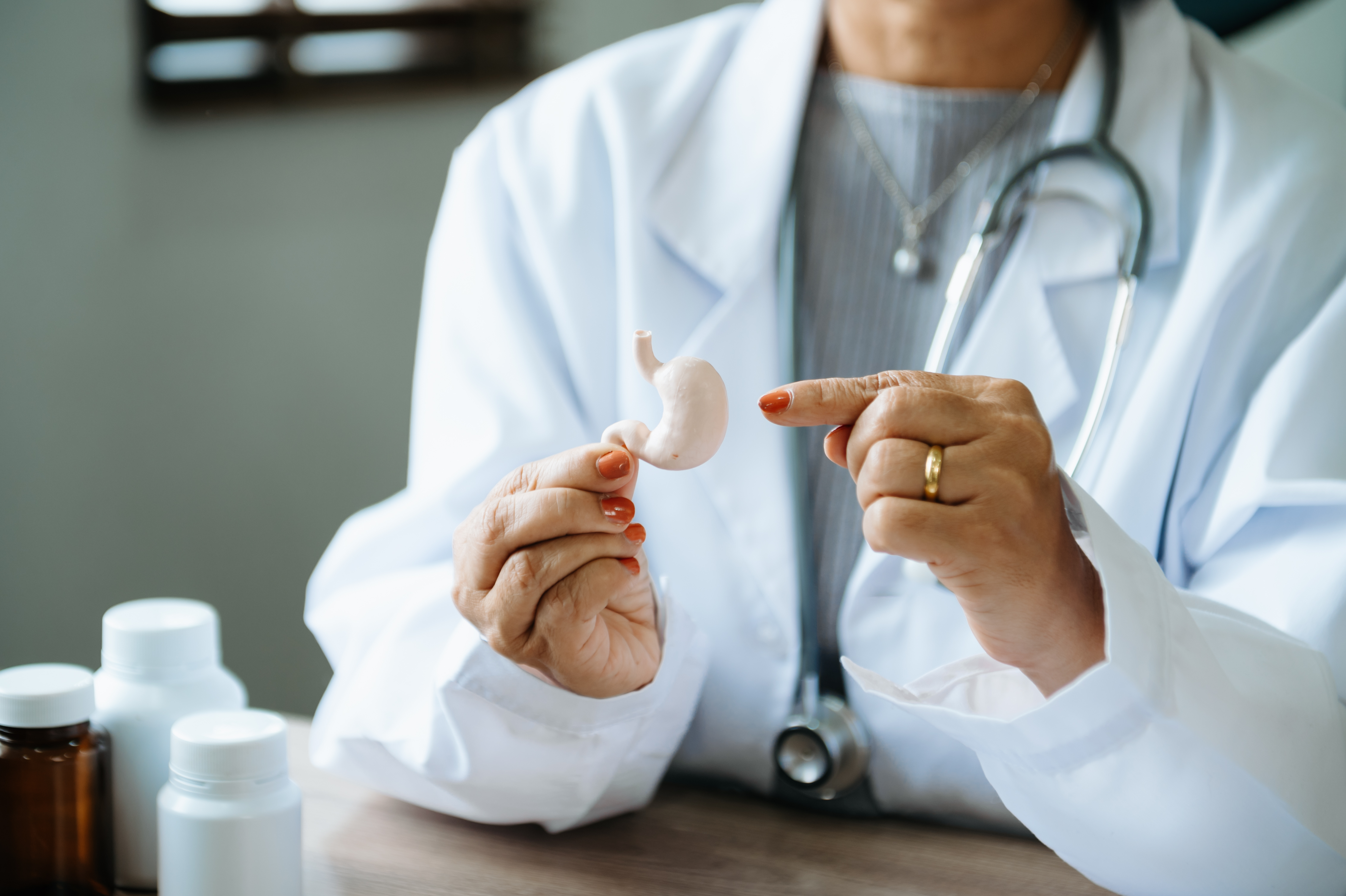 female-doctor-holding-intestine-hand-right-